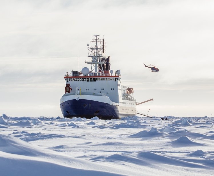 Photo of an icebreaker and helicopter