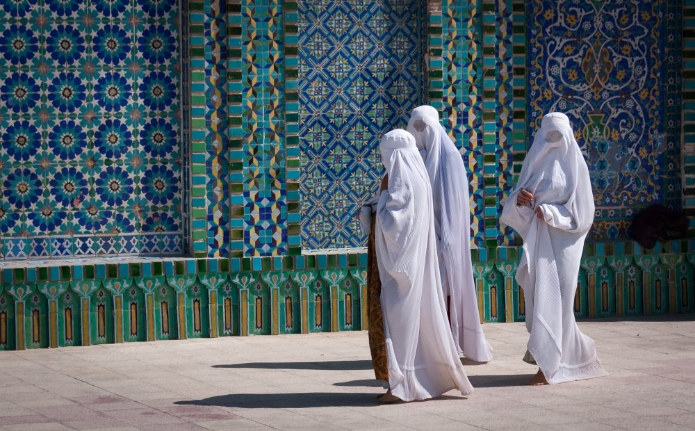 Women in burqas at a mosque