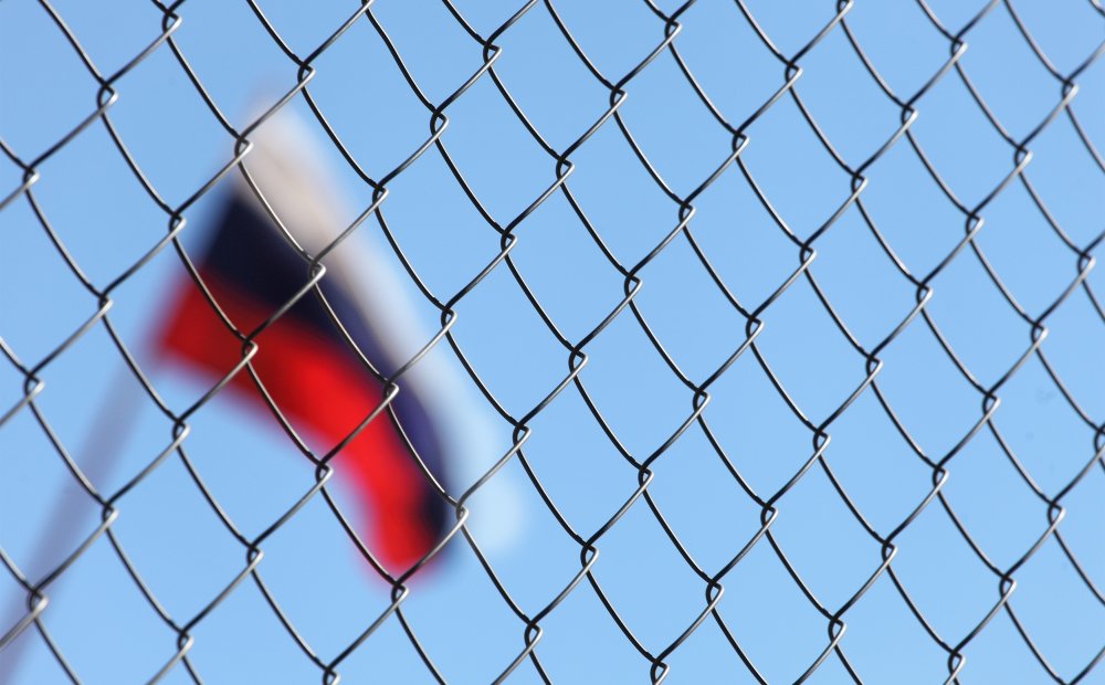 The Russian flag behind fence