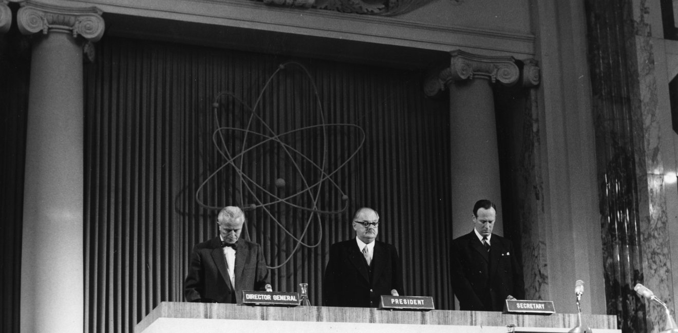 Mr Sterling Cole (left), Director General of the International Atomic Energy Agecny, Austrian Chancellor Dr. Julius Raab (center) and Dr. Paul R. Jolles, Deputy Director General for Administration, Liaison and Secretariat pause for a minute of silence at the opening session of the second Annual General conference of the IAEA. Delegates from more than 60 countries are attending the meeting. (Hofburg, former Imperial Palace, Vienna, Austria, 22 September 1958)