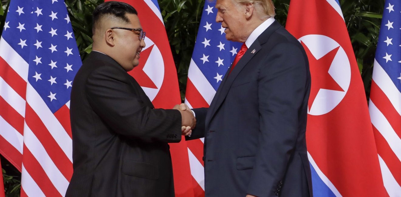 Trump Kim Summit U.S. President Donald Trump shakes hands with North Korea leader Kim Jong Un at the Capella resort on Sentosa Island Tuesday, June 12, 2018 in Singapore.