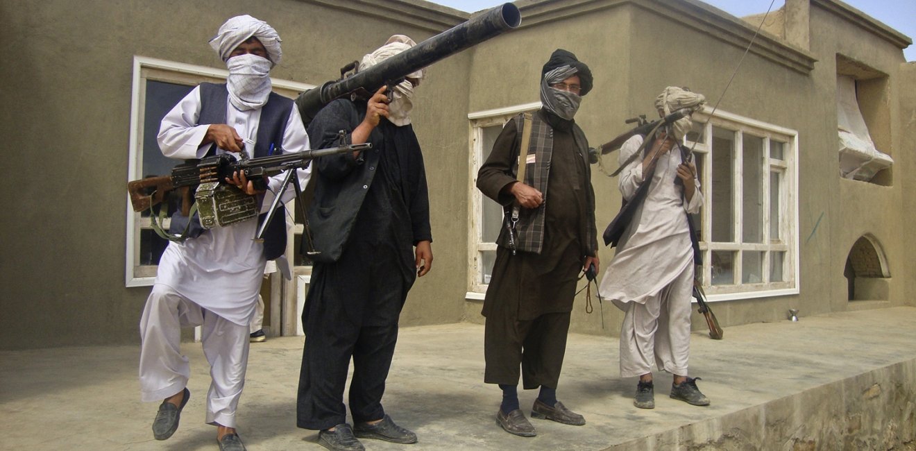 Taliban fighters pose with weapons at an undisclosed location in southern Afghanistan in this May 5, 2011 picture. REUTERS/Stringer