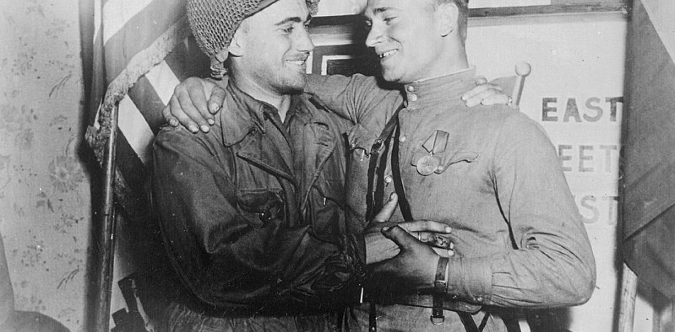 Happy 2nd Lt. William Robertson and Lt. Alexander Sylvashko, Red Army, near Torgau, Germany in April 1945. Source: US National Archives and Records Administration, #531276.