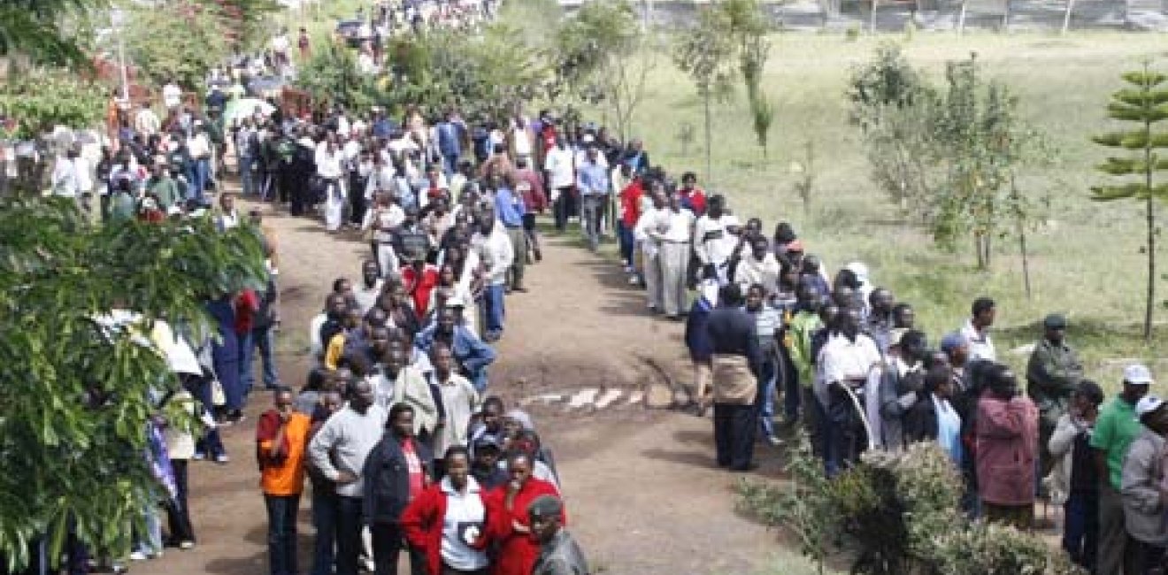 Voters queuing at a polling station in Kenya during the 2007 elections. Photo courtesy of User DEMOSH via Flickr Commons.