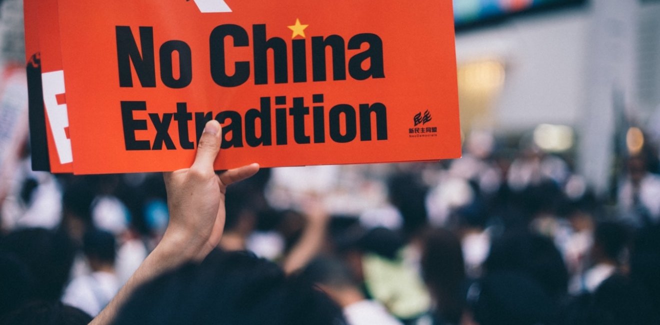 Protester holds sign in Hong Kong extradition protests. Source: Unsplash.com