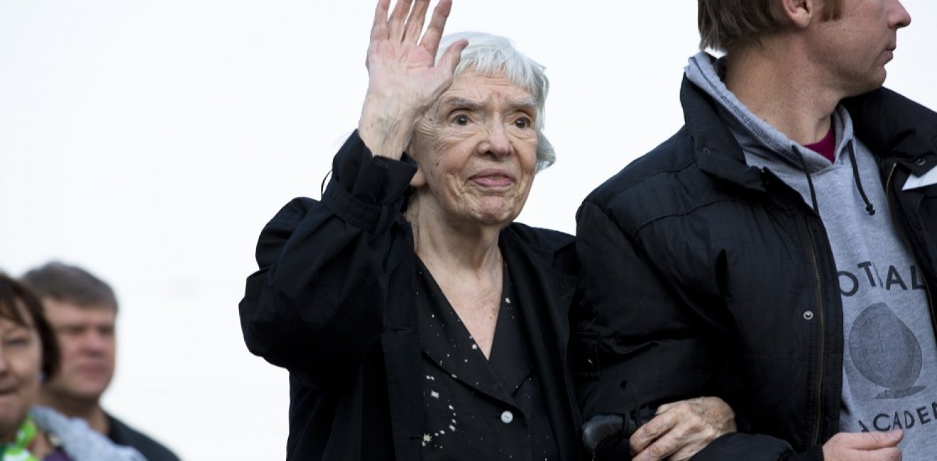 Lyudmila Alexeyeva waving at an opposition rally in 2013