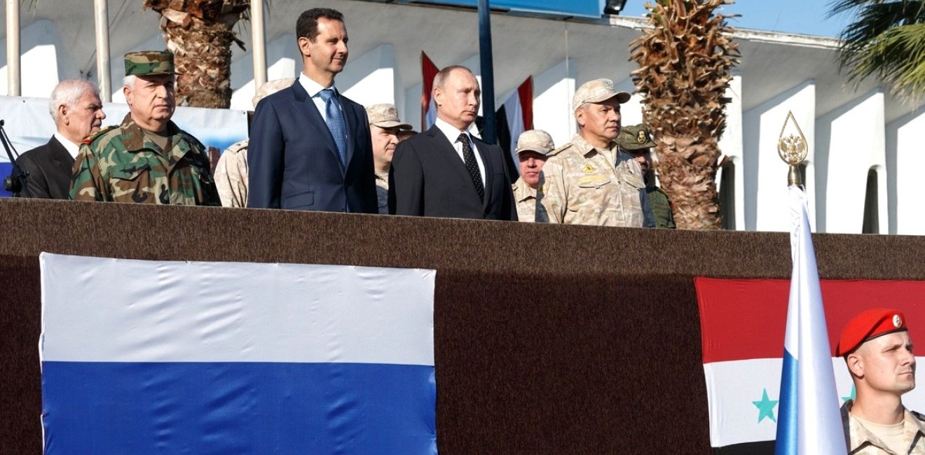 At the Khmeimim air base in Syria. With President of Syria Bashar al-Assad (left) and Defence Minister of Russia Sergei Shoigu (right). Source: Kremlin.ru