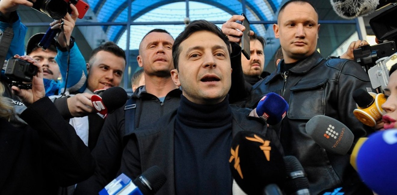 Volodymyr Zelenskiy talking to reporters in Kyiv. Source: Shutterstock.