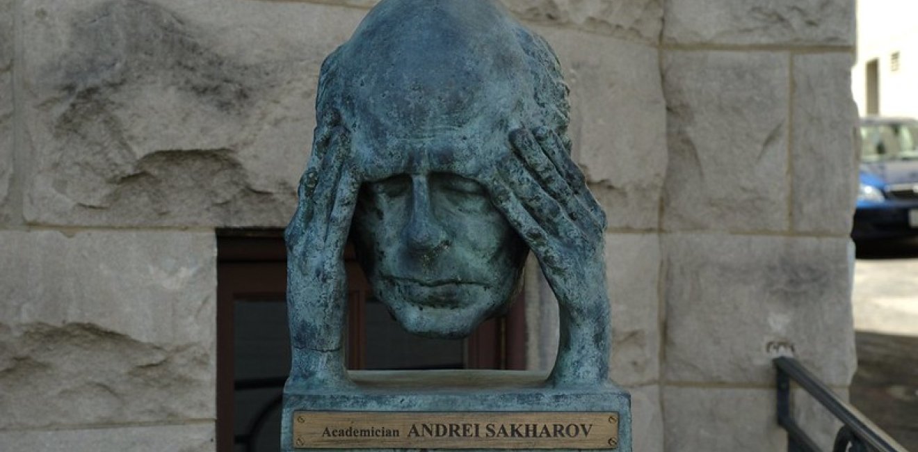 Bust of man holding head in hands