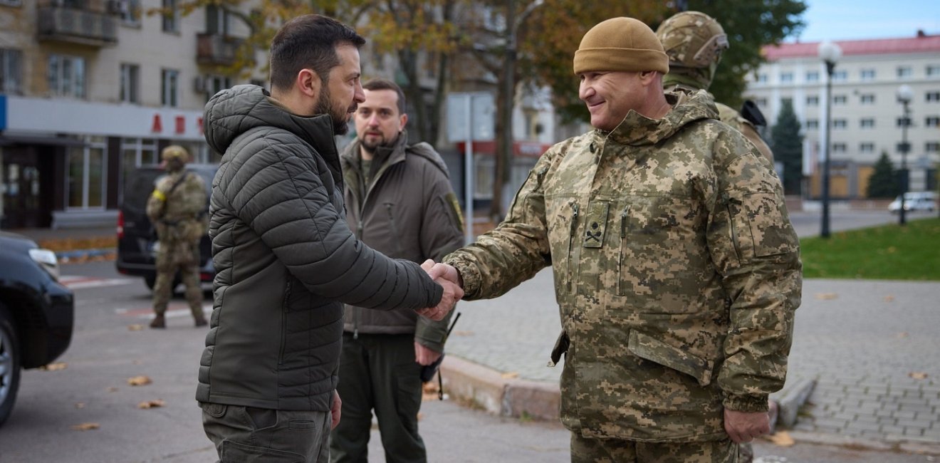 President Zelensky shaking hands with member of Ukrainian Military 