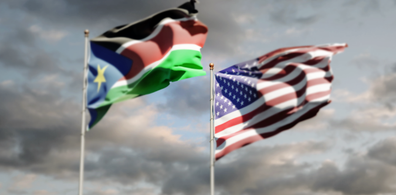 National flags of South Sudan and USA together at the sky background