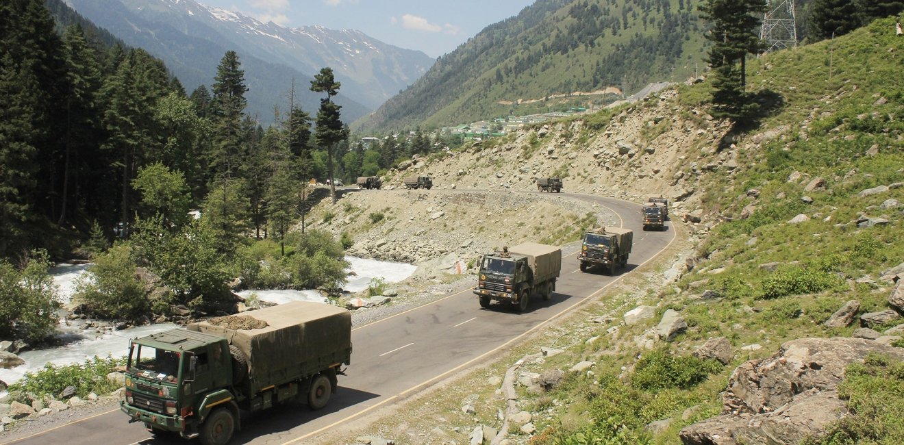 An Indian army convoy of trucks moving along the Srinagar-Ladakh highway.