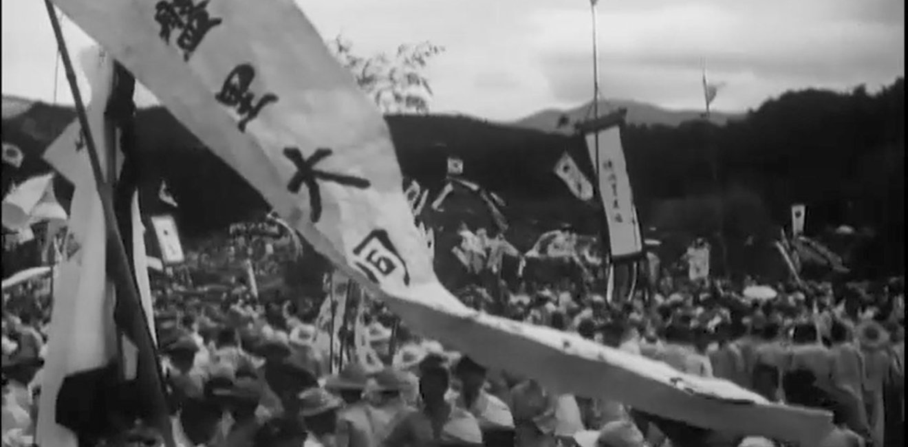 A banner with Korean text flies during a celebration.