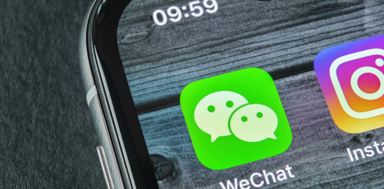 A phone showing the logo for the WeChat app