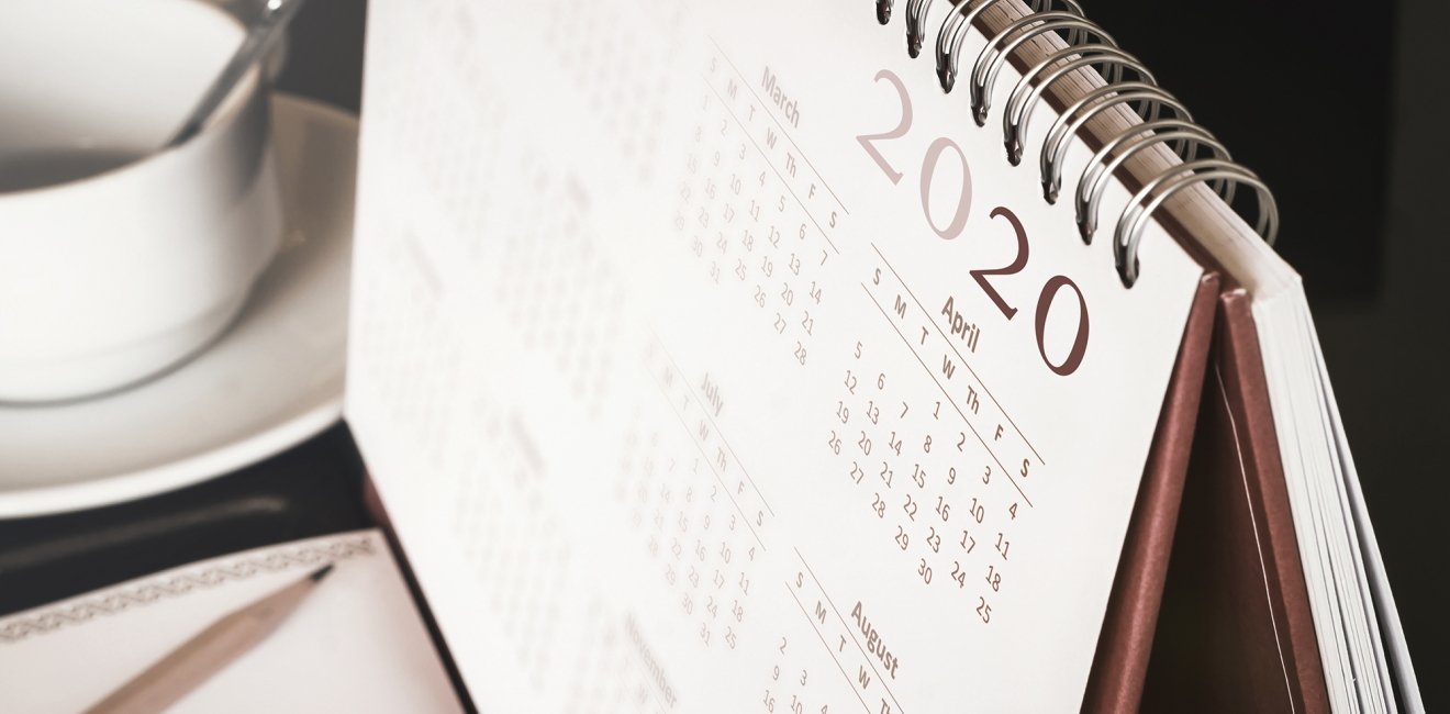 A close up of a desk calendar with the year 2020 visible