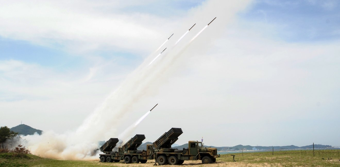 South Korean army units firing rockets.