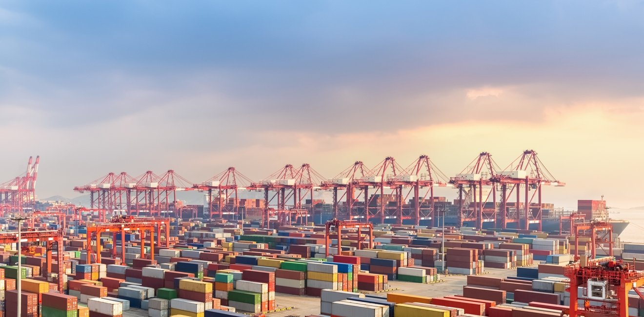 Image of the Shanghai port with shipping containers.