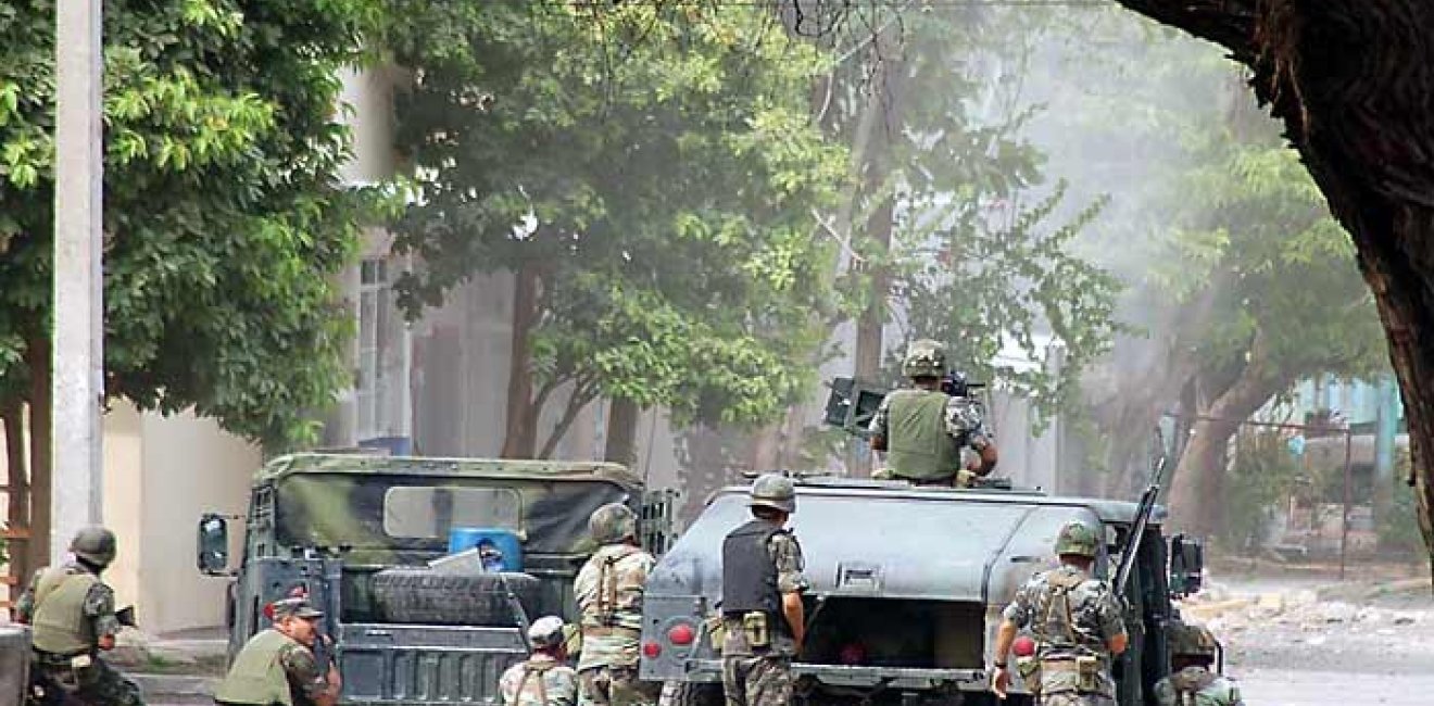 Soldiers huddled in Michoacan.