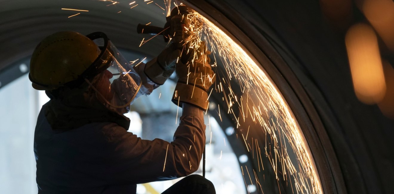 US Factory Worker Wielding Pipe