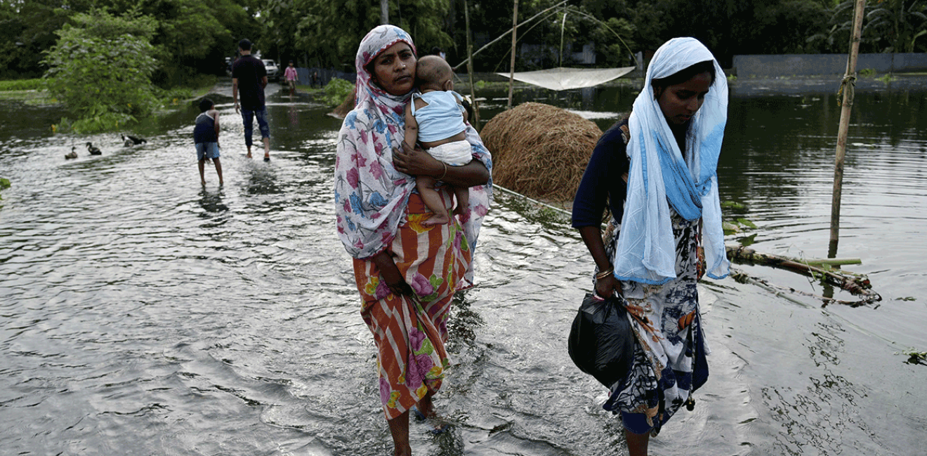 Women walking in flood