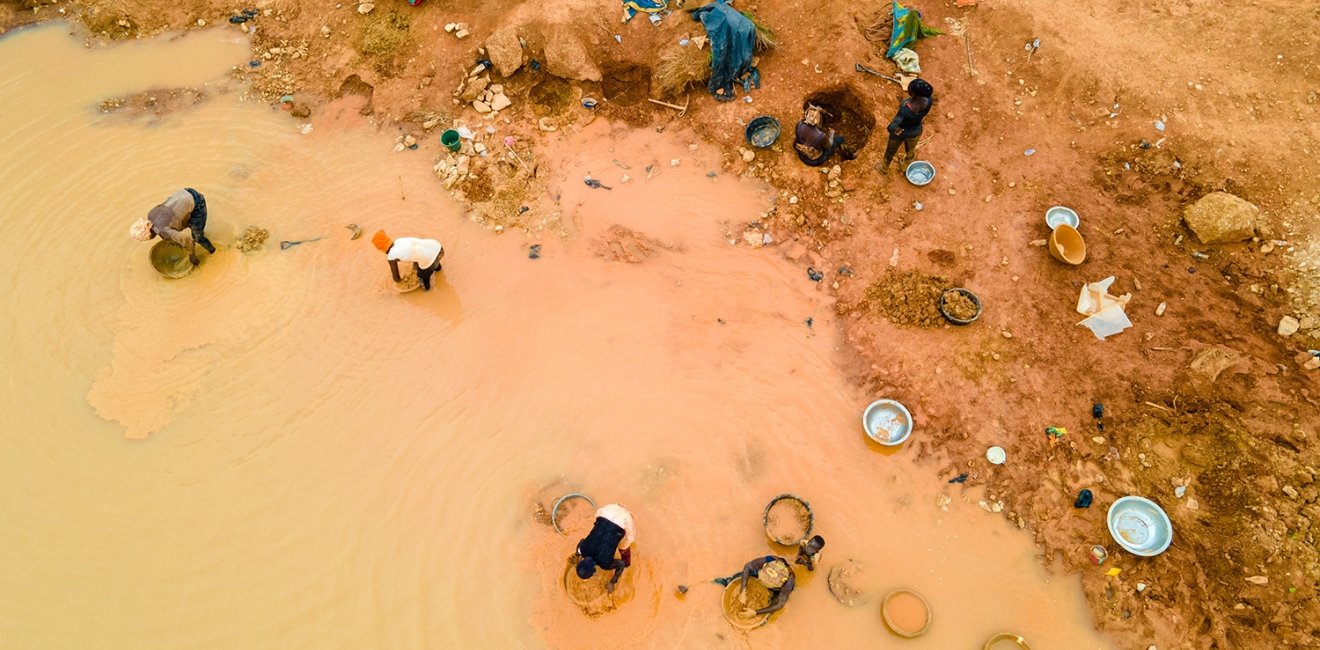 Kunsu, Ghana, March 20, 2023: Rural Women in Small Scale Mining (Galamsey) in Ghana, Africa. The quest for the daily meal of these women relies on them finding gold in an already mined land.