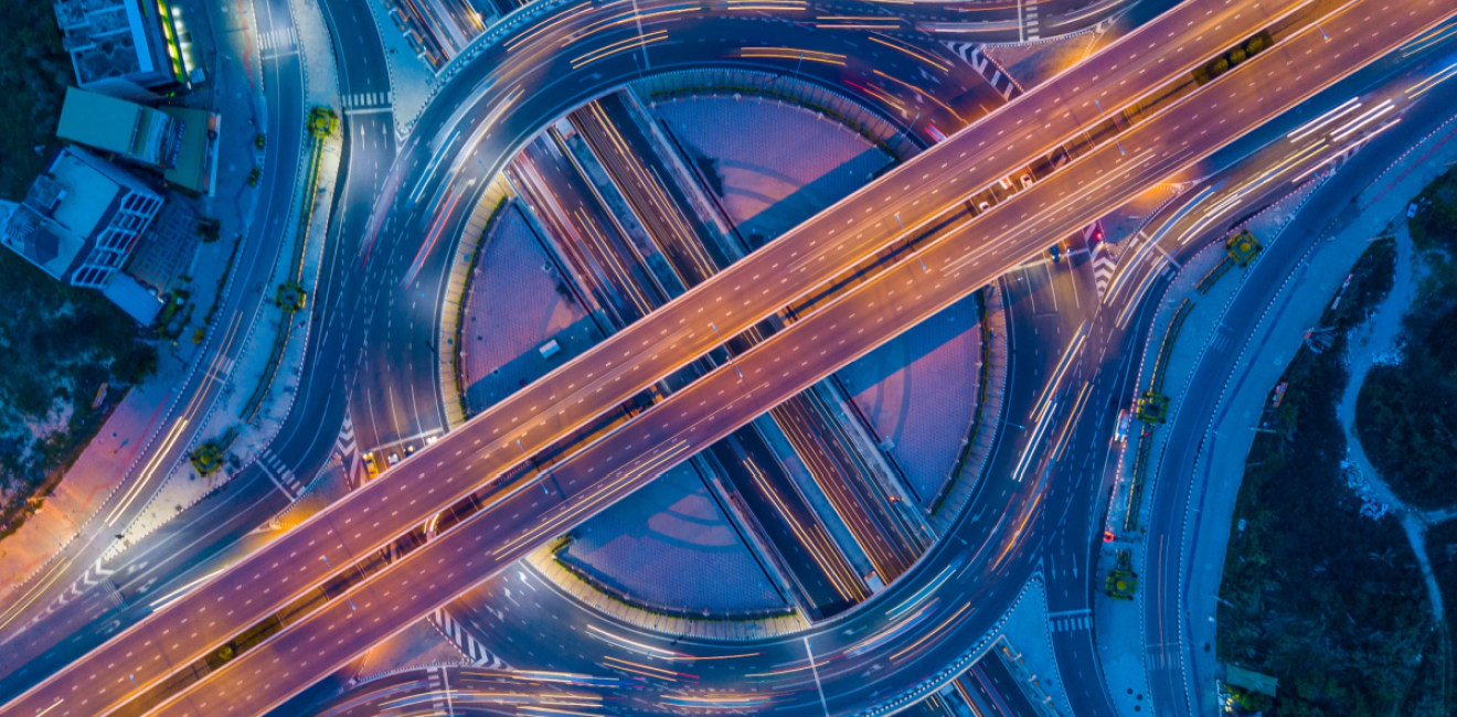 Aerial shot of a roundabout interchange at night