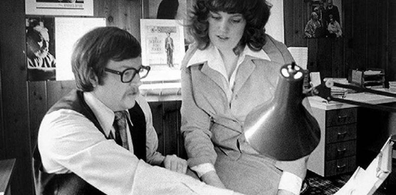 Black and White photo of man and woman in studio