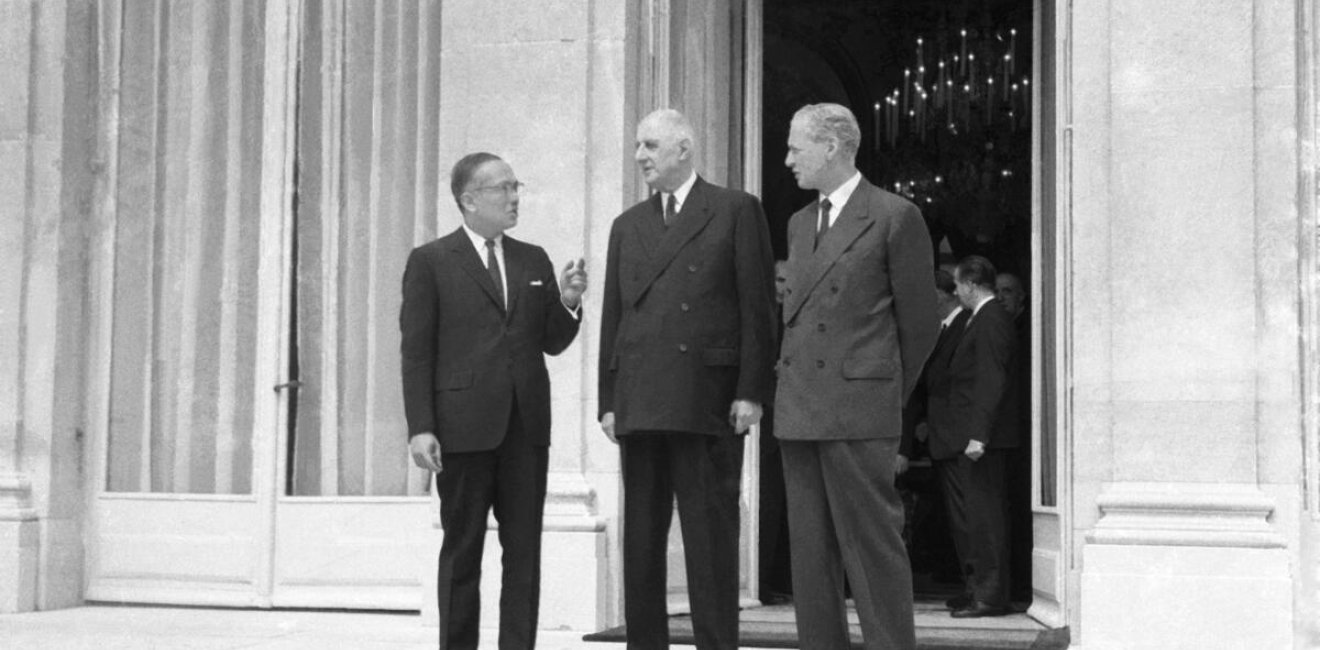 UN Secretary-General, U Thant (left), during his visit to Elysee Palace for discussions with President Charles de Gaulle (centre) and Minister of Foreign Affairs Maurice Couve de Murville (right).