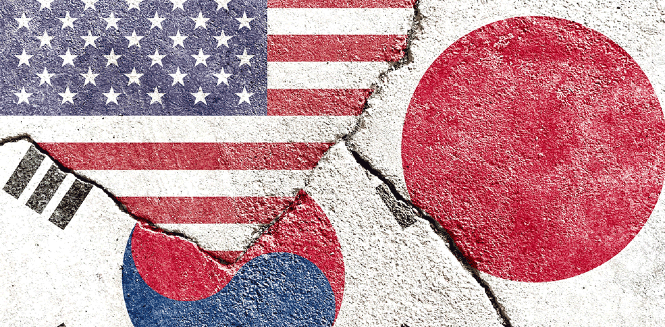 US, South Korea, and Japan Flags on concrete