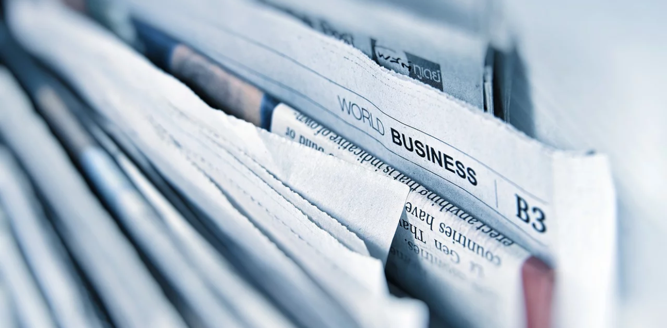 Stack of English Language Newspapers