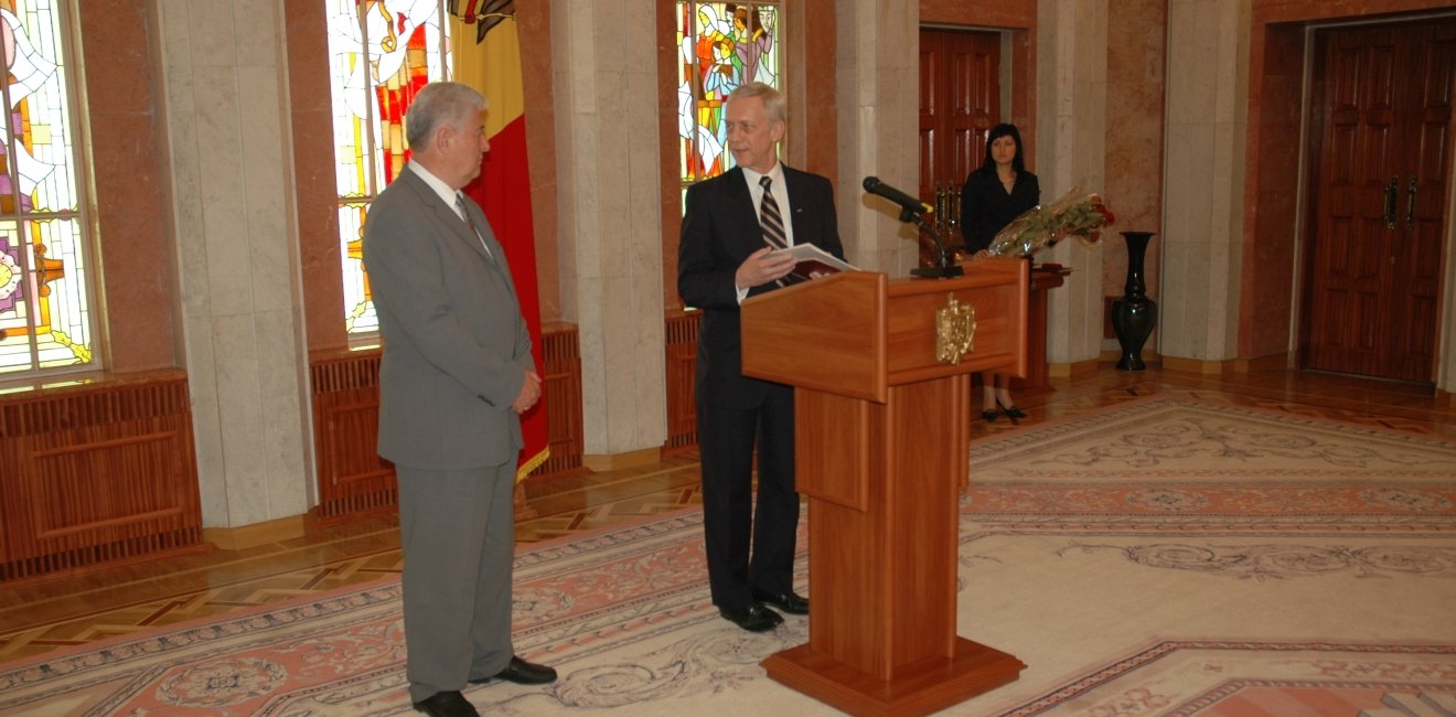 Picture of William H. Hill (right) with Vladimir Voronin, taken by the Moldovan Presidential Administration, June 2006. Hill was receiving an award at the end of his term as OSCE Head of Mission