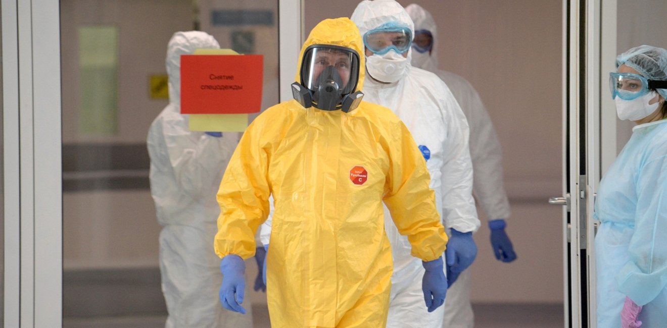 In a sign that the Kremlin's attitude toward the virus hazard is changing, President Vladimir Putin visited a hospital for infectious disease and changed into a hazmat suit