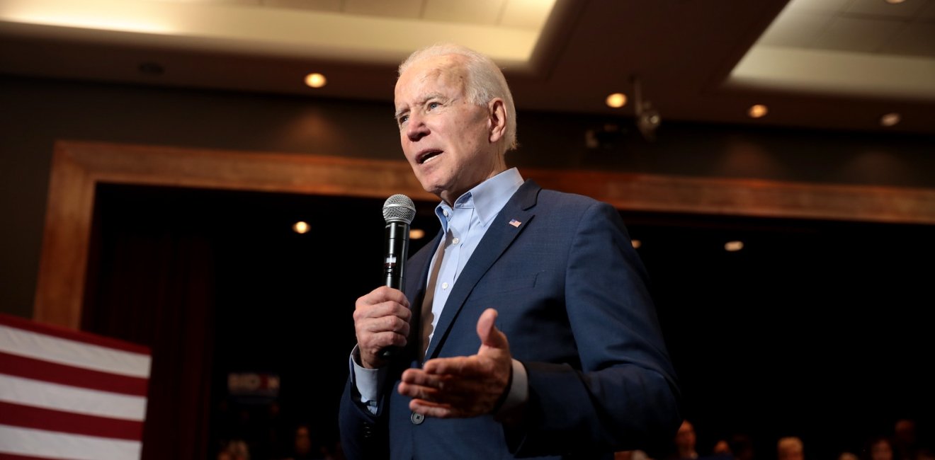 Joe Biden Talking into a Microphone at a campaign event 