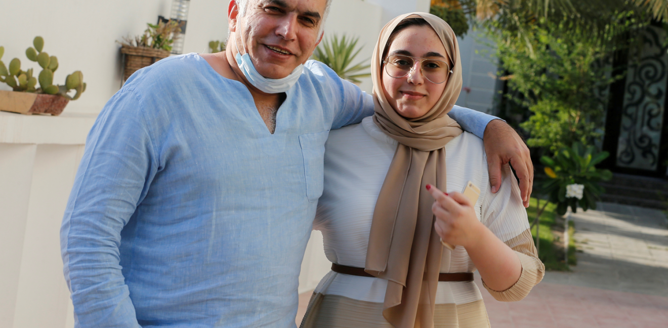 Nabeel Rajab and his daughter pose after he is freed from prison