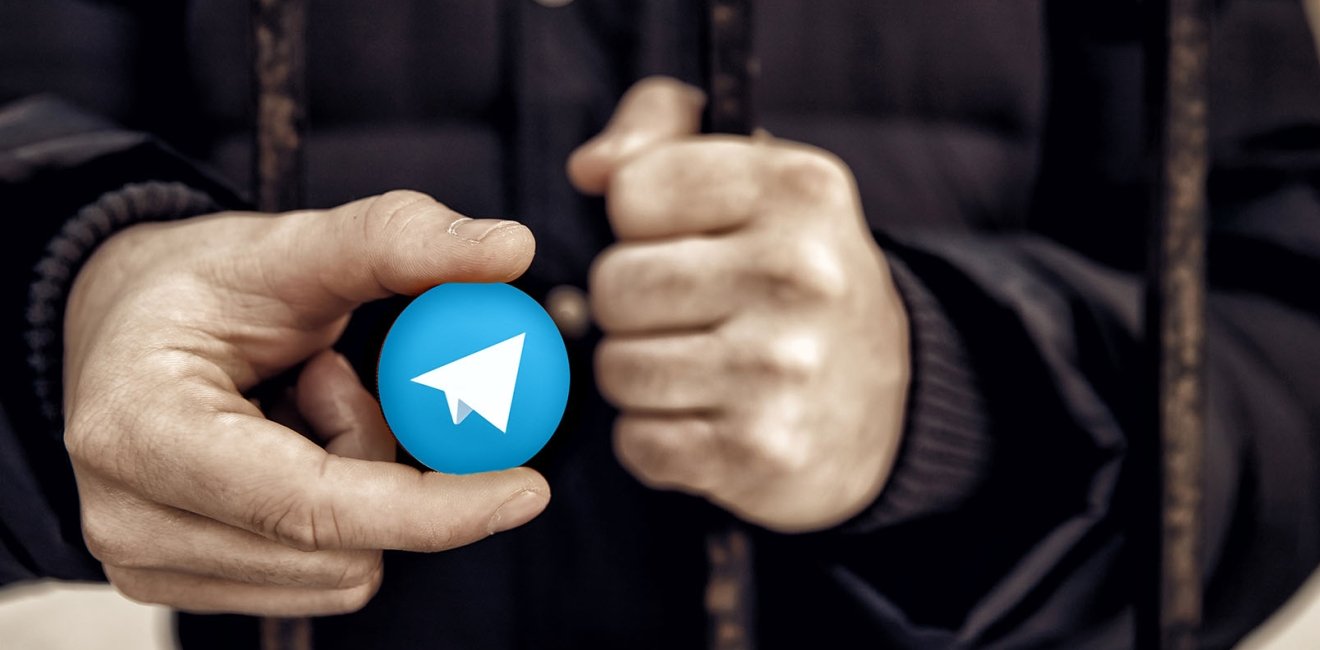 Man Holding Telegram logo