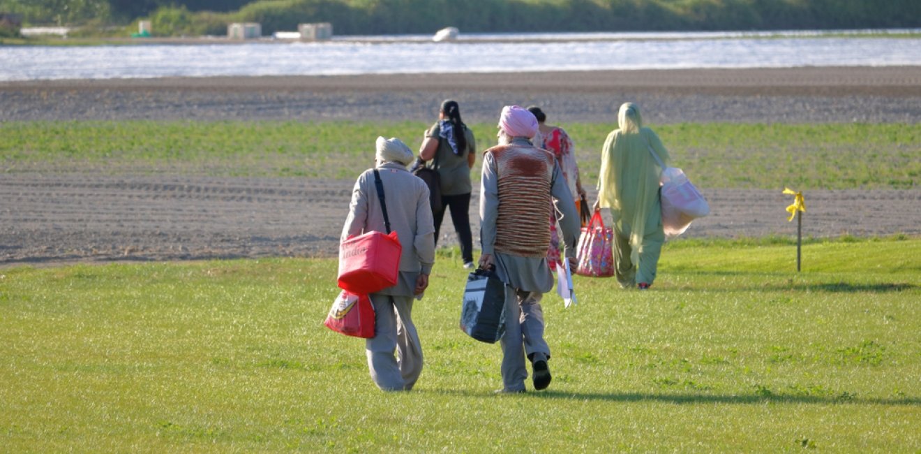 Canadian Sikhs walking in a field