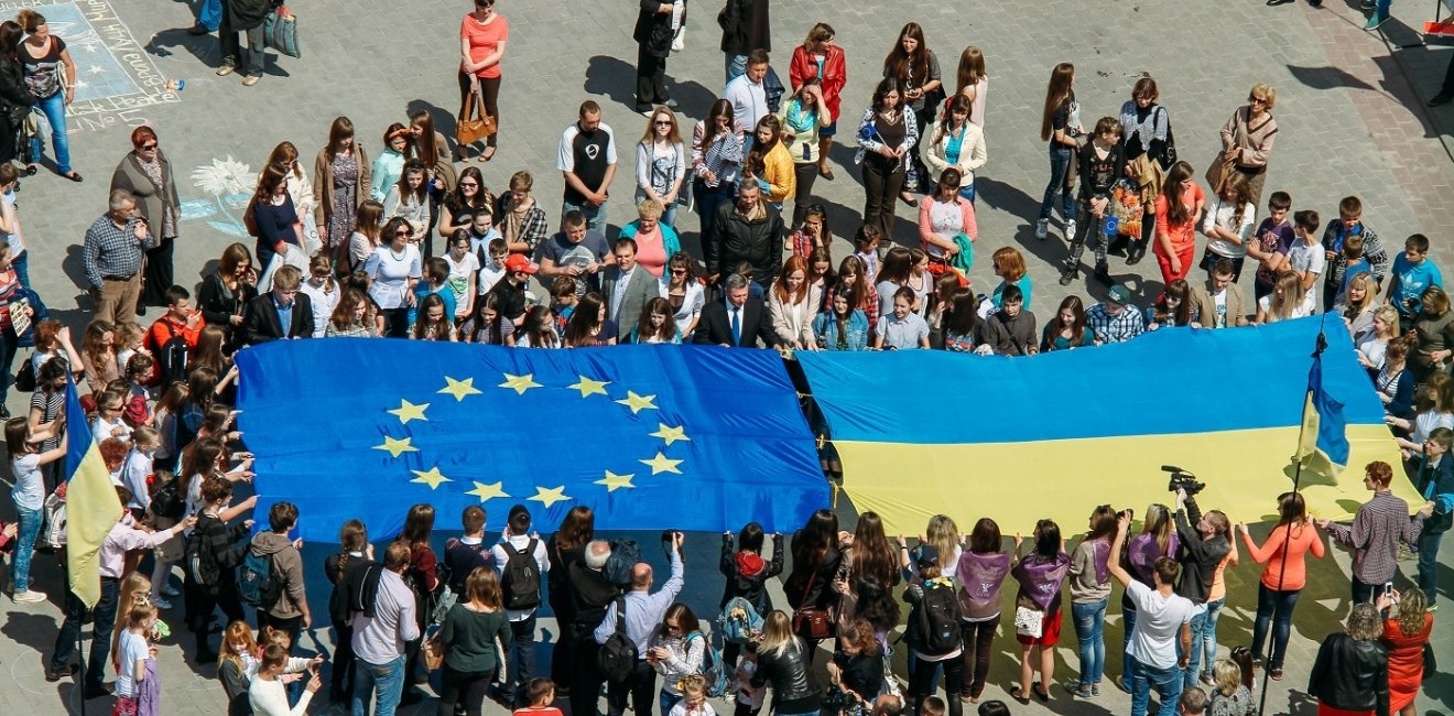 Crowd holding EU and Ukrainian Flag