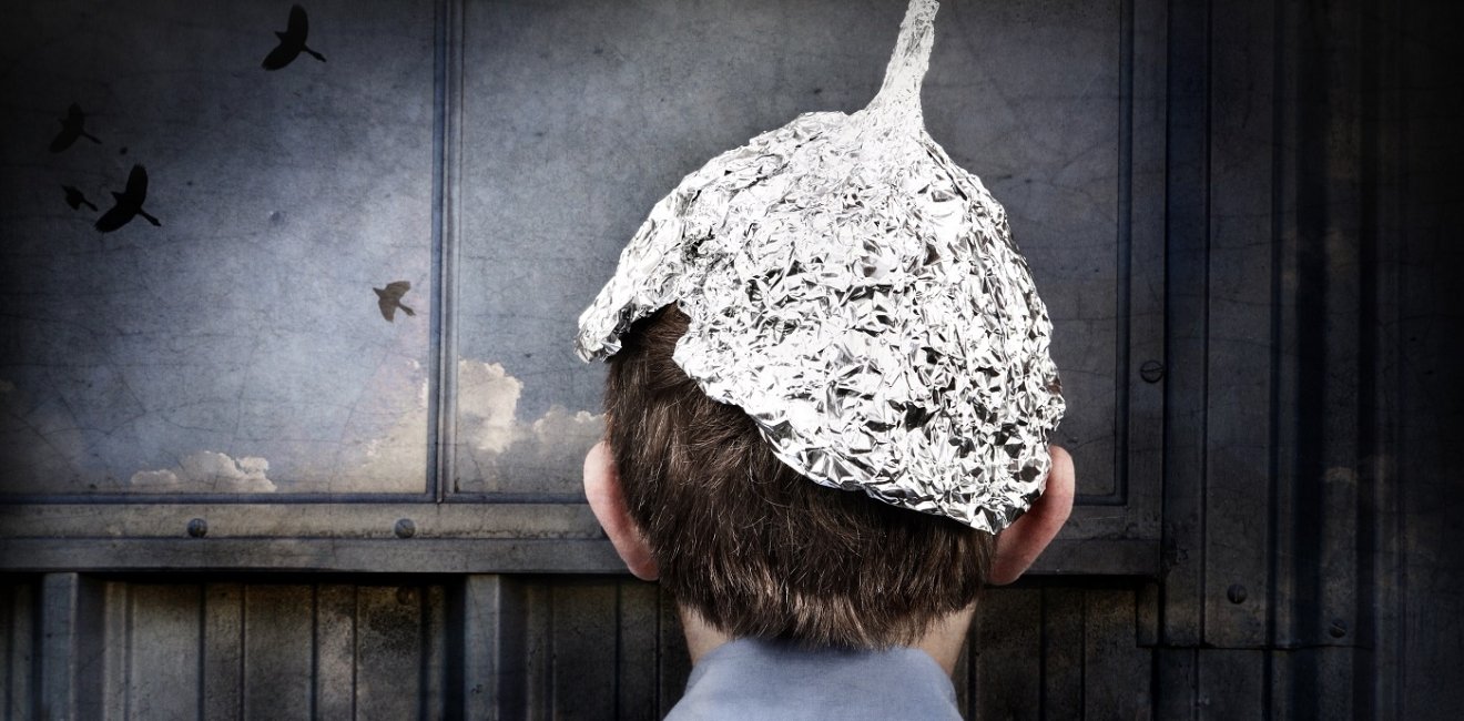 Young person wearing a tin foil hat