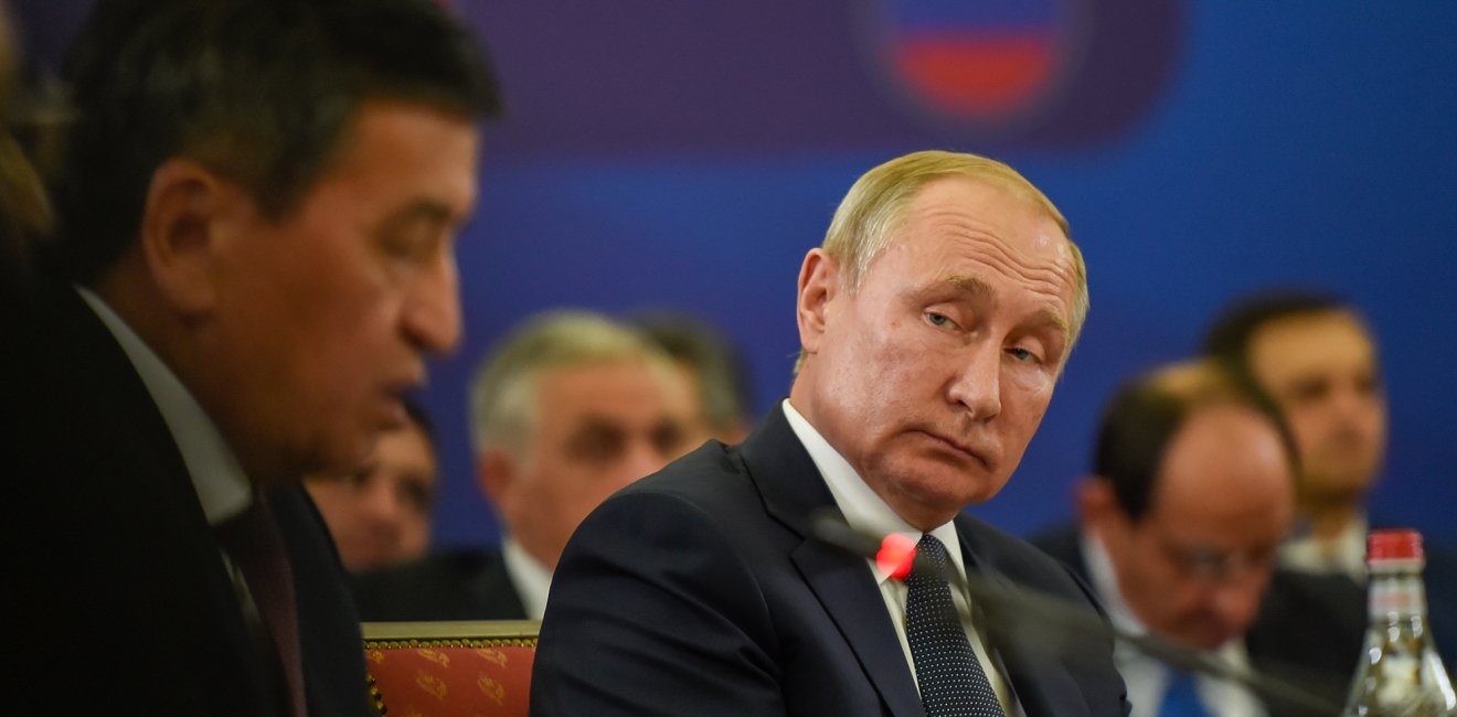 Russian President Vladimir Putin listen to president of Kyrgyzstan Sooronbay Jeenbekov during meeting of the Supreme Eurasian Economic Council in Yerevan, Armenia.