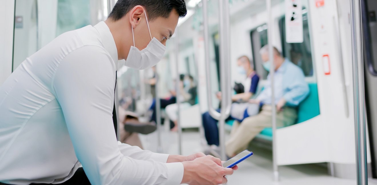 Man on subway with mask