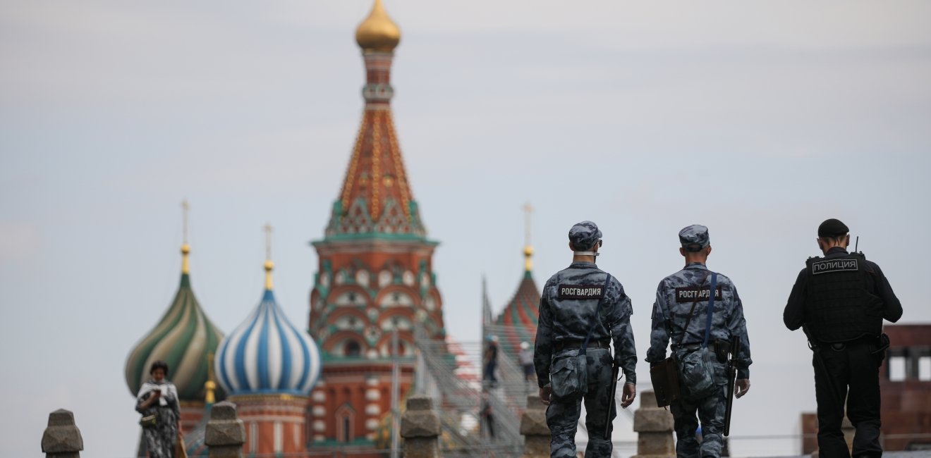 Russian police officers walk across Red Square.