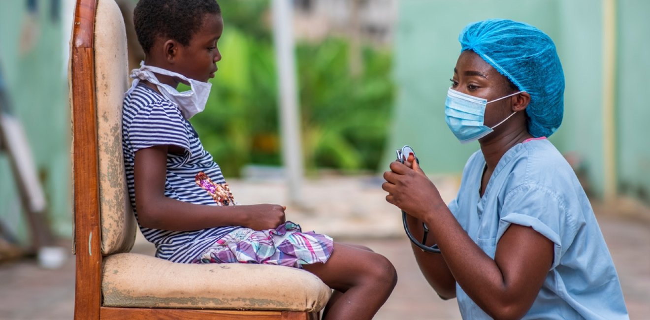 African Healthcare Worker and Child