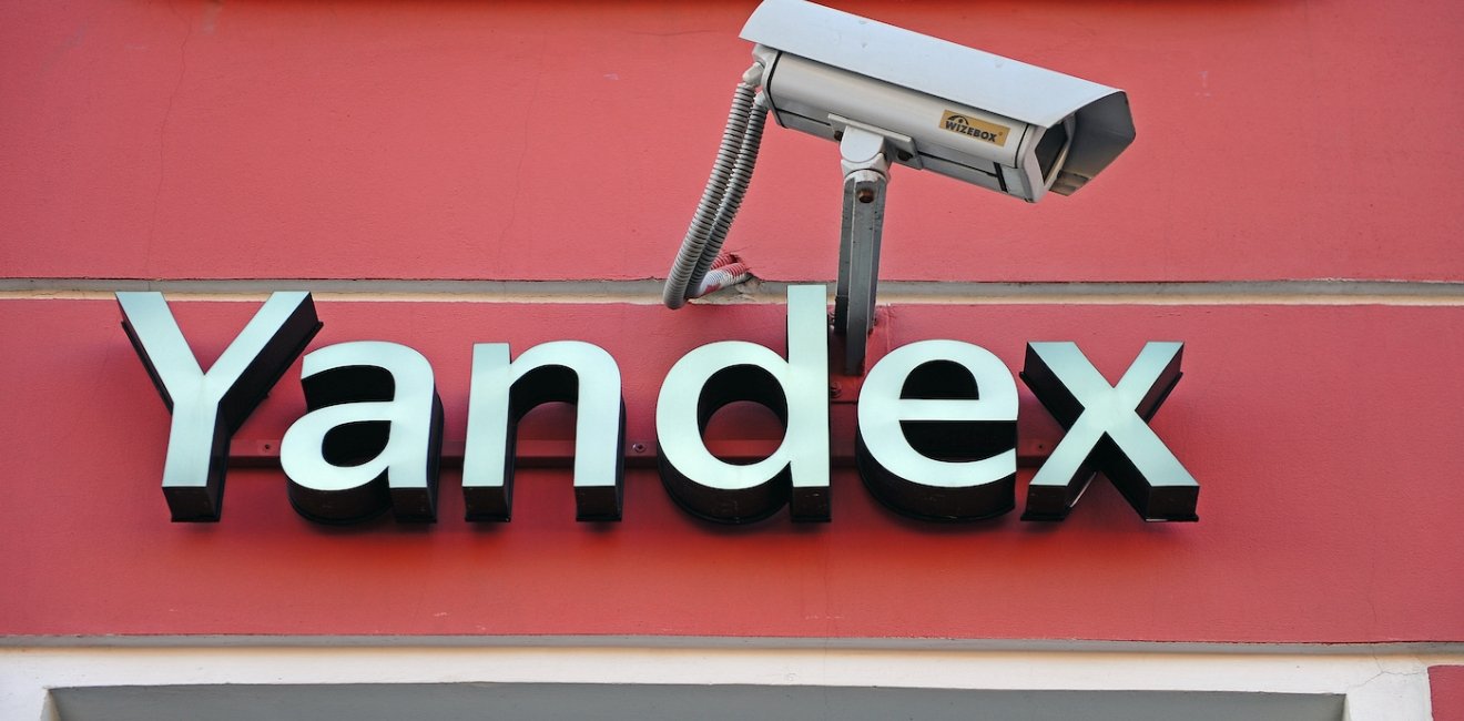 Yandex city store facade and logo accompanied by a surveillance camera