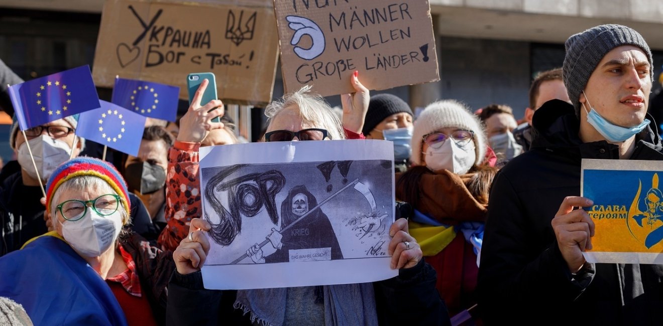 Group of protesters holding sign 