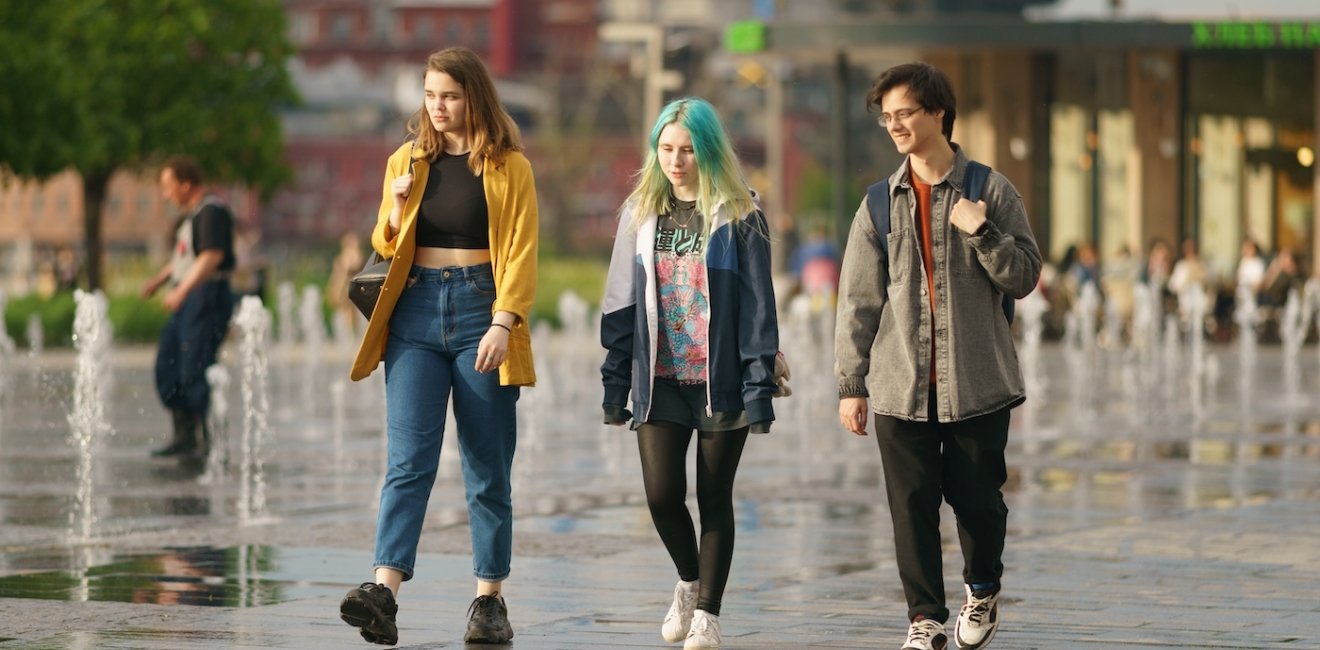 Moscow, Russia - June 1, 2022: Teenagers walking across the dry fountains.