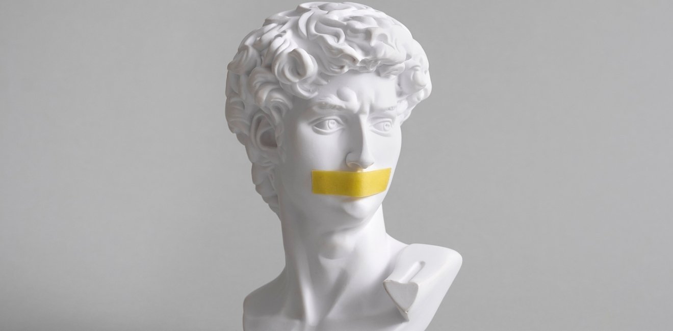 Michelangelo's David head bust with duct tape sealed mouth. 