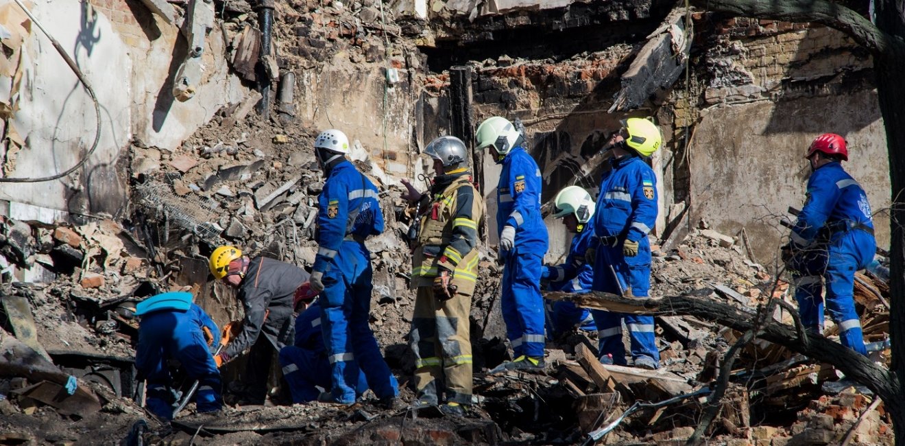 Rescuers are searching for people under the rubble of a collapsed house in Kyiv after a drone attack