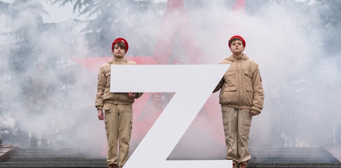 Soldiers standing with a large Z