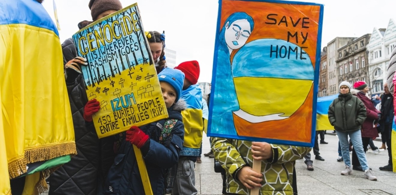 Protesters with signs against the Russian invasion