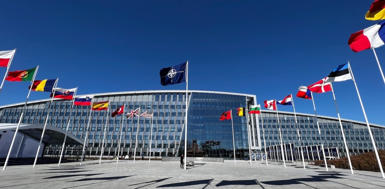 The national flags of NATO member countries outside the organization’s headquarters in Brussels, Belgium